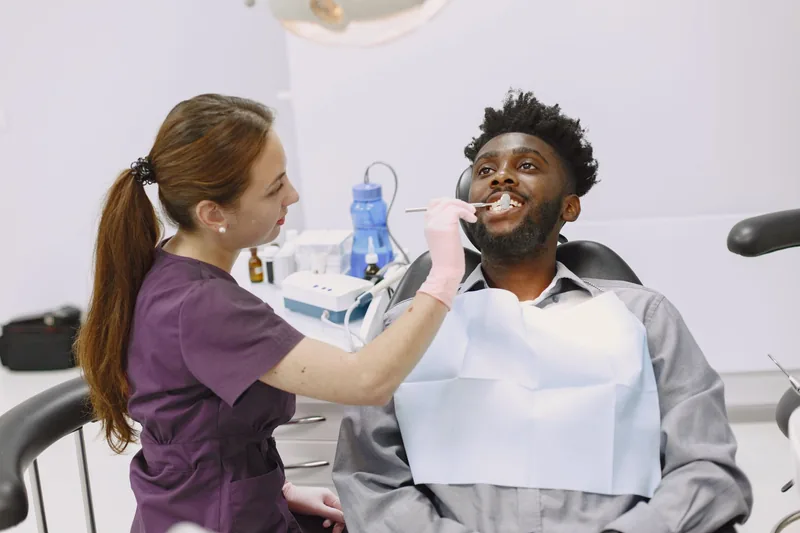 Dentist examining a patient's teeth