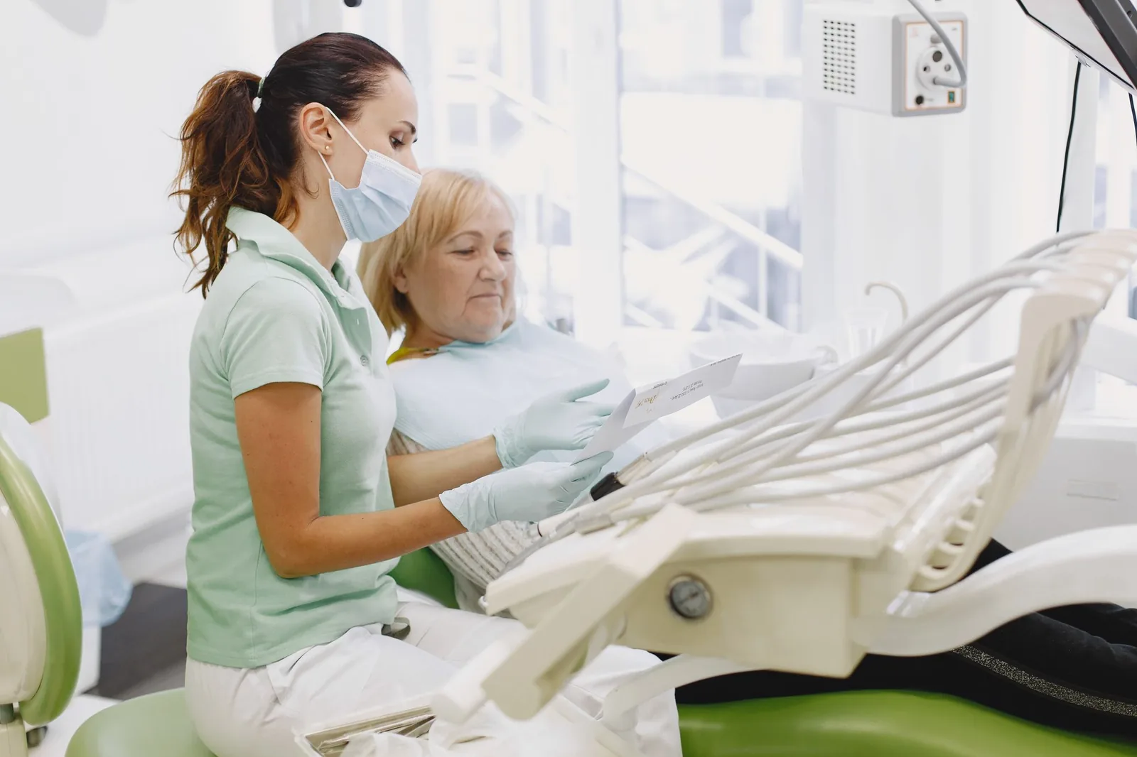 Dentist explaining a checkup result to a patient