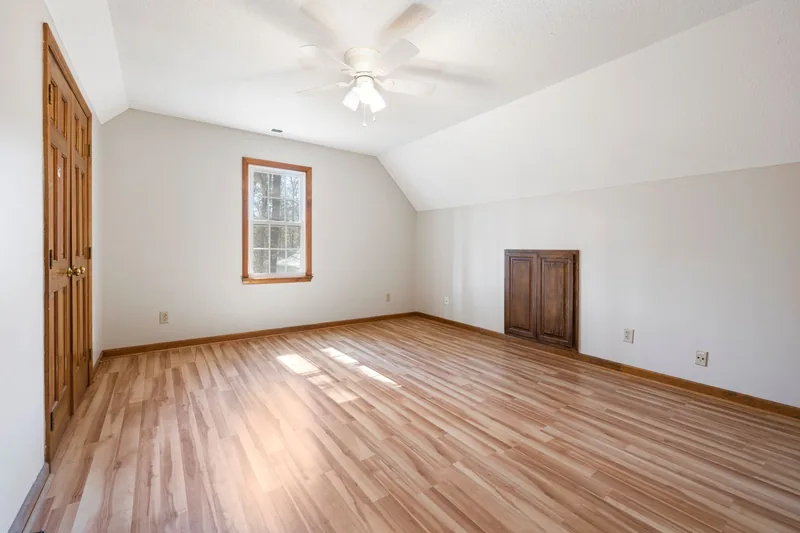 Bright bedroom with freshly finished hardwood floor