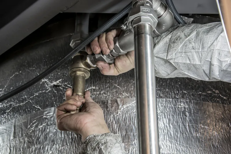 Plumber fitting steel pipes with a wrench