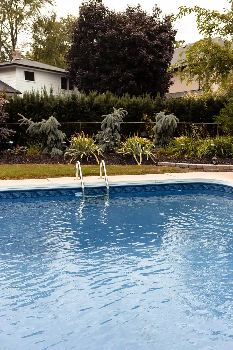 Backyard swimming pool with clear blue water
